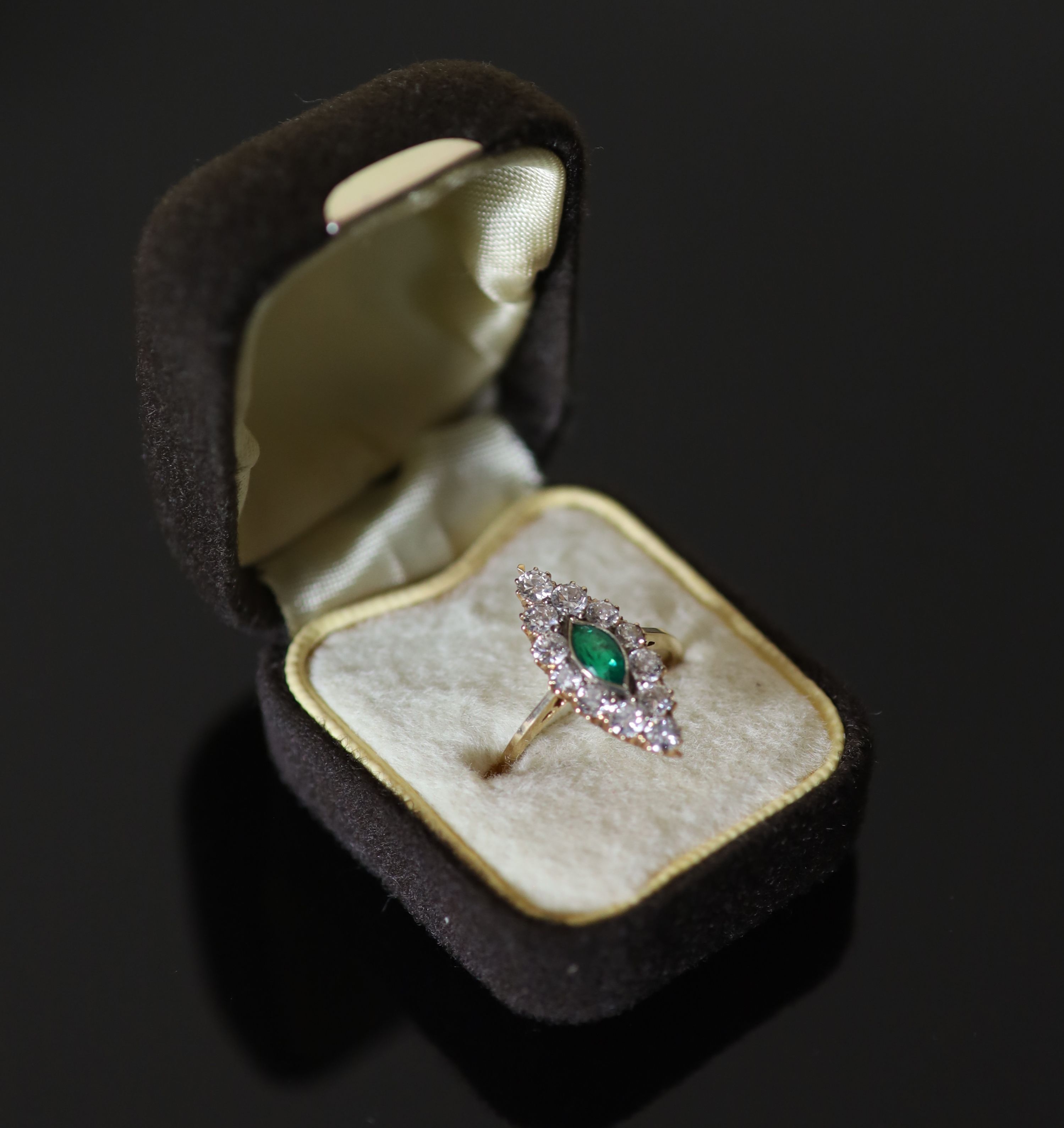A Victorian style gold, emerald and diamond cluster set marquise shaped ring,